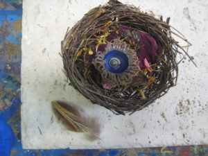 Sharing me Amulet composed of Bird Nest - home Acorn Cap = protection Blue = expansive sky Spiral shell = possibilities Flower petals = beauty Feather = spirit